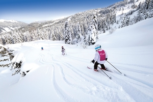 Child skiing downhill